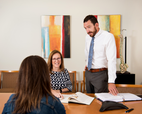 Richards Brandt's Lori Hansen and Cody Kesler in meeting